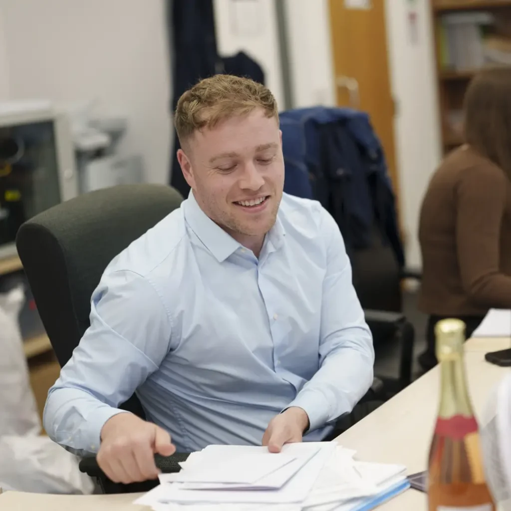 MJ Goldman staff at desk.